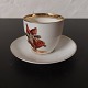 Coffee cup with 
saucer In 
porcelain. 
Unknown 
manufacturer. 
Painted elf 
decoration. 
Father Elf ...