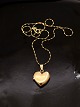 14 carat gold 
medallion heart 
1.8 x 2 cm. and 
14 carat chain 
40 cm. subject 
no. 564297