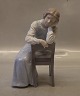 B&G 1611 Woman 
sitting pensive 
on a chair 22 x 
13 cm
 Bing and 
Grondahl Marked 
with the three 
...
