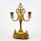 French candlestick in gilded bronze, 19th century. With two light arms. Decorated with putto. ...