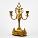 French 
candlestick in 
gilded bronze, 
19th century. 
With two light 
arms. Decorated 
with putto. ...