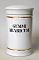 Apothecary jar 
in porcelain. 
19th century 
White porcelain 
with two gilt 
edges. Black 
text "GUMMI ...