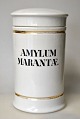Apothecary jar 
in porcelain. 
19th century 
White porcelain 
with two gilt 
trims. Black 
text ...