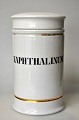 Apothecary jar 
in porcelain. 
19th century 
White porcelain 
with two gilt 
trims. Black 
text ...