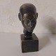 Black bust, head in plaster
