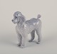 Royal 
Copenhagen, 
rare porcelain 
figurine of a 
Standard 
Poodle.
Model number 
4757.
Design ...