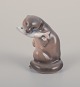 Royal Copenhagen, porcelain figurine of an otter with a fish in its mouth.