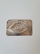 Votive in 
silver with 
motif of an eye 

Stamped 800
Dimension 5 x 
7.5 cm.