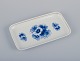 Meissen, Germany. Rectangular porcelain dish hand-decorated with blue floral 
motifs, gold rim.