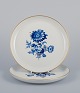 Meissen, Germany. Two plates. Hand-decorated with blue floral motifs, gold rim.