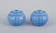 Maria Torstensson for Royal Copenhagen, a pair of ceramic candlesticks. 
For candles and tealights.
Glaze in blue shades. Drop-shaped decoration.