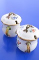 Royal 
Copenhagen 
porcelain. Hand 
painted Saxon 
flower, 
mustardpot with 
cover, no. 
4/1594. Height 
...