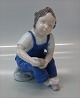 Bing and 
Grondahl B&G 
2275 Boy with 
shoe  Blue 14 
cm Marked with 
the three Royal 
Towers of ...