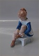 Bing and 
Grondahl B&G 
2373 Marianne 
Girl tying 
shoes 15,5 cm 
Claire Weiss 
1964 Marked 
with the ...
