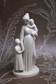 Royal Copenhagen white porcelain figure of "Motherhood" 
mother with her 2 children...