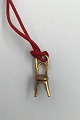 Georg Jensen 
Gilded Brass 
Cafe Chair 
Pendant No. 
5217 Measures 
2.3 cm x 1.0 cm 
(0.90 inch x 
0.39 ...