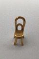 Georg Jensen 
Gilded Brass 
Cafe Chair 
Pendant 
Measures 1.7 cm 
x 0.7 cm (0.66 
inch x 0.27 
inch)  ...