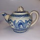 Anders Høy 
teapot In 
ceramic. Blue 
decoration on 
light brown 
ground. A 
little wear 
here and ...