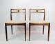 Experience timeless elegance with this set of two chairs, model 94, created by the talented ...