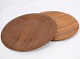 The teak plates 
from the 1960s 
are a charming 
manifestation 
of the 
mid-century 
modern 
aesthetic. ...