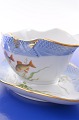 Royal 
Copenhagen fish 
service. 
Sauce boat nr. 
19/1212-3003, 
length 26.5 cm. 
10.5 inches. 1. 
...