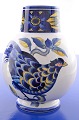 Royal 
Copenhagen 
faience. RC. 
Blue Pheasant 
Vase no. 1 737 
818. Width 15 
cm. Height 21 
cm. 5 7/8 ...