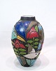 This large 
ceramic floor 
vase is a 
beautiful 
ornate object, 
decorated with 
motifs of birds 
and ...