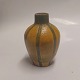 Orange vase In 
ceramics with 
decoration of 
green vertical 
stripes by the 
Danish potter 
Karl ...