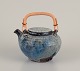 Gutte Eriksen, 
Denmark.
Unique ceramic 
teapot, raku 
technique, 
flowing lava 
glaze in 
blue-gray ...