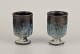 Gutte Eriksen, 
Denmark.
Two cups in 
ceramic, raku 
technique, 
flowing lava 
glaze in 
blue-gray ...