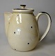 Herman A. 
Kähler coffee 
pot, 20th 
century, 
Næstved, 
Denmark. Light 
glaze with 
black dots, 
black ...