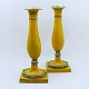 Pair of 
Augustenborg 
yellow-painted 
tin 
candlesticks