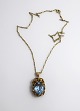 Viggo Wollny, 
Copenhagen. 
Gold pendant 
and necklace 
14K (585). 
Length of 
pendant 4 cm. 
Length of ...