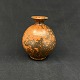 Height 15.5 cm.
Fine orange 
and black 
speckled vase 
from Kähler.
It is signed 
HAK ...