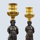 Pair of French 
bronze 
candlesticks 
with gilded 
base and top, 
the stem is a 
silver-plated 
...
