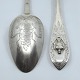 Pair of silver 
spoons with 
classic 
engravings and 
pierced shaft.
L. 23 cm.
Engraved on 
the ...