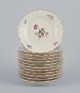 Royal 
Copenhagen, 
"Frijsenborg". 
Twelve plates.
Decorated with 
floral motifs, 
gold ...