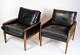 This set of two 
elegant 
armchairs in 
rosewood with 
black leather 
cushions exudes 
classic Danish 
...