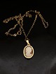 14 carat gold 
pendant 2.2 x 
1.5 cm. with 
came and 14 
carat gold 
chain 53 cm. 
Item No. 576041