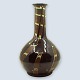 Kähler vase 
with slim neck. 
Decorated with 
dark brown, 
turquoise and 
lighter brown 
glaze.
H. ...