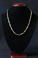 Beautiful gold 
chain with 
solid links, 
connected with 
eyelets. The 
structure of 
the chain is 
...