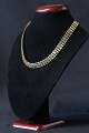Gold necklace 
in 14 carat 
gold with V 
pattern and box 
...