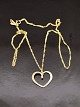 B. Hertz 14 
carat gold 
heart pendant 2 
x 1.6 cm. and 
14 carat chain 
42 cm. Item No. 
577010