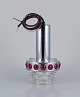 RAAK, Holland. 
Designer lamp 
in chrome, red 
plastic, and 
clear glass.
Approximately 
from the ...