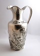 A.F.R. Silver 
(830). Water 
jug with floral 
motif. Height 
26 cm. Produced 
1904.