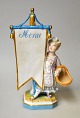 French 
porcelain 
figure, 19th 
century. 
Standing girl 
with basket and 
menu card. 
Polychrome ...