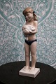 Royal 
Copenhagen 
porcelain 
figure of girl 
with rabbit, 
design by 
Sterett Kelsey. 
Decoration ...