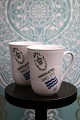 Royal 
Copenhagen 
Fluted 
Signature Mug 
with handle. H: 
11cm. 33 cl. 
Decoration 
number: 497. 
...