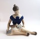 Bing & Grondahl. Porcelain figure. Sitting girl with cat. Model 2329. Height 12 
cm. (1 quality)