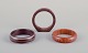 French jewelry 
designer.
Three 
bracelets. Two 
in plastic and 
one in wood. 
Amber-colored 
and in ...